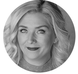 a woman wearing a white shirt and black hair