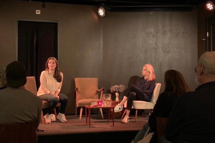 a group of people sitting at a table in a room