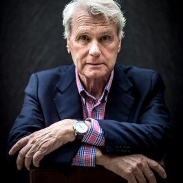 Adriaan van Dis wearing a suit and tie