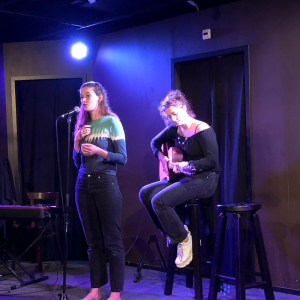 a man and a woman standing on a stage