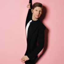 a man standing next to a woman