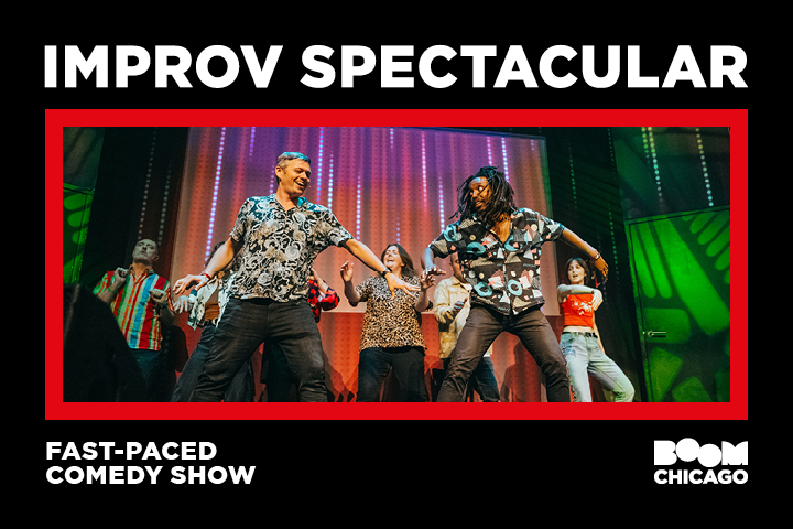 Performers dancing energetically on stage with colorful lights during an improv comedy show.