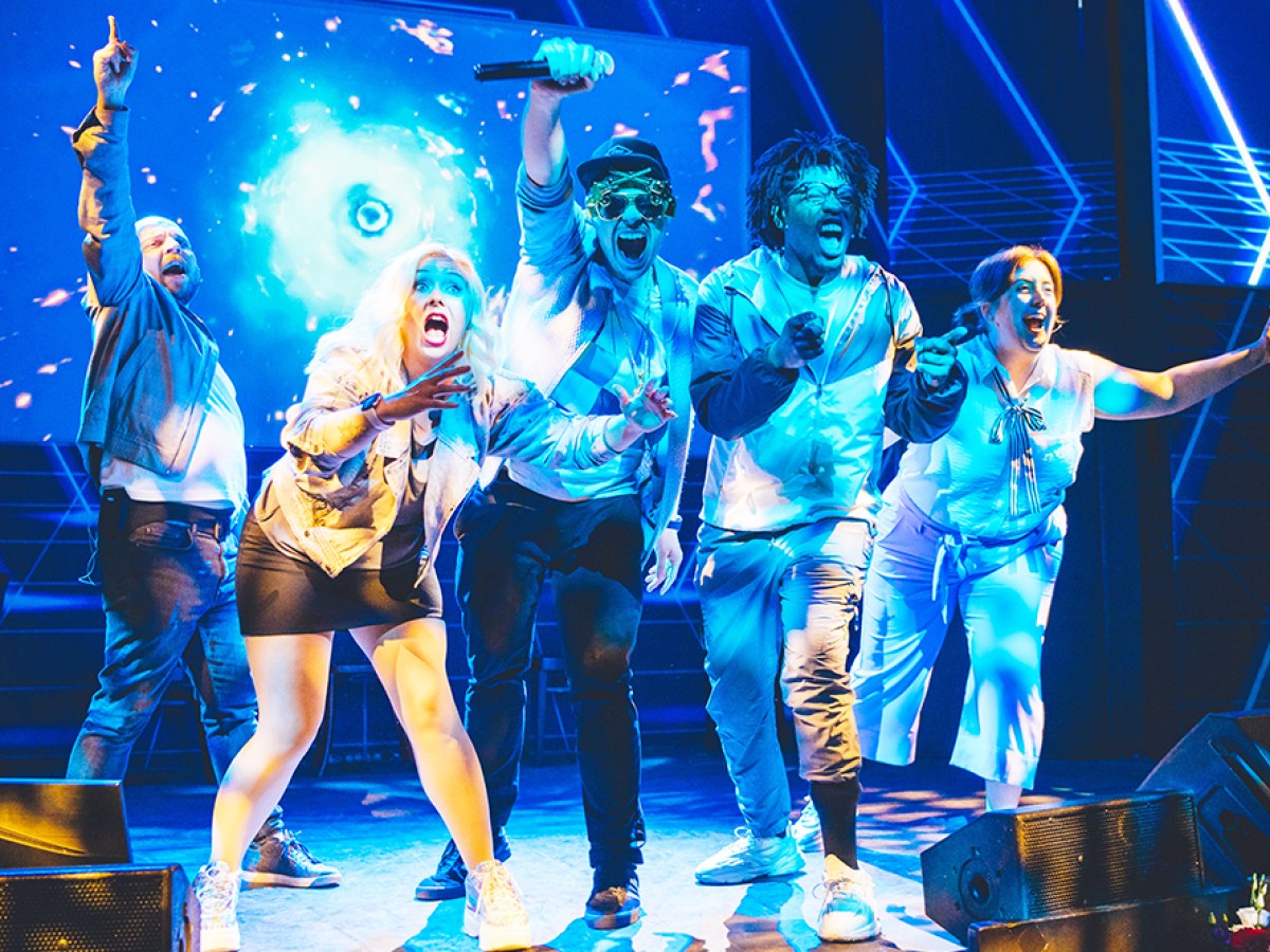 a group of people standing on a stage
