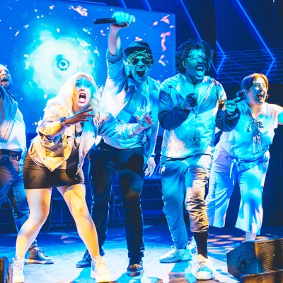 a group of people standing on a stage