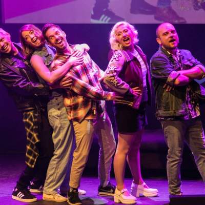 a group of people standing on a stage