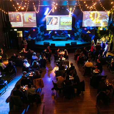 a group of people playing instruments and performing on a stage
