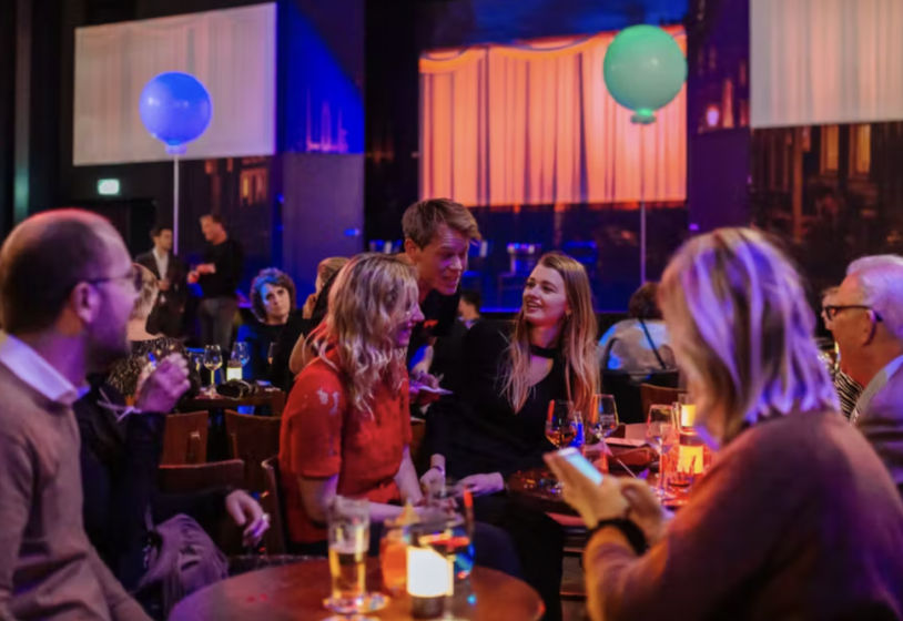 a group of people sitting at a table