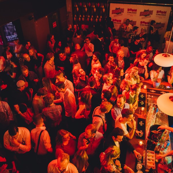 a crowd of people in a dark room