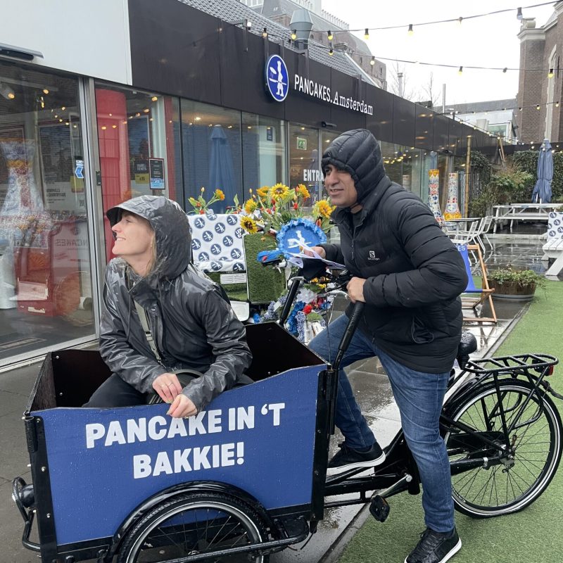 a person standing next to a bicycle