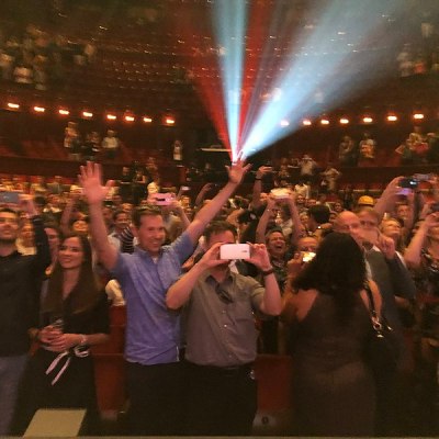 a group of people standing in front of a crowd