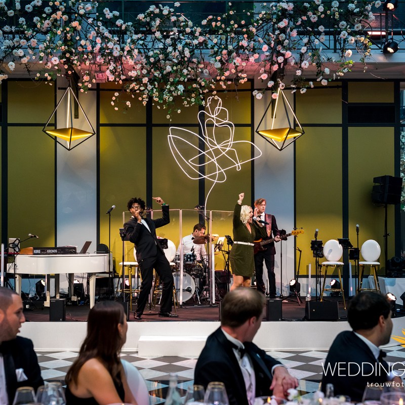 a group of people sitting at a table in a restaurant