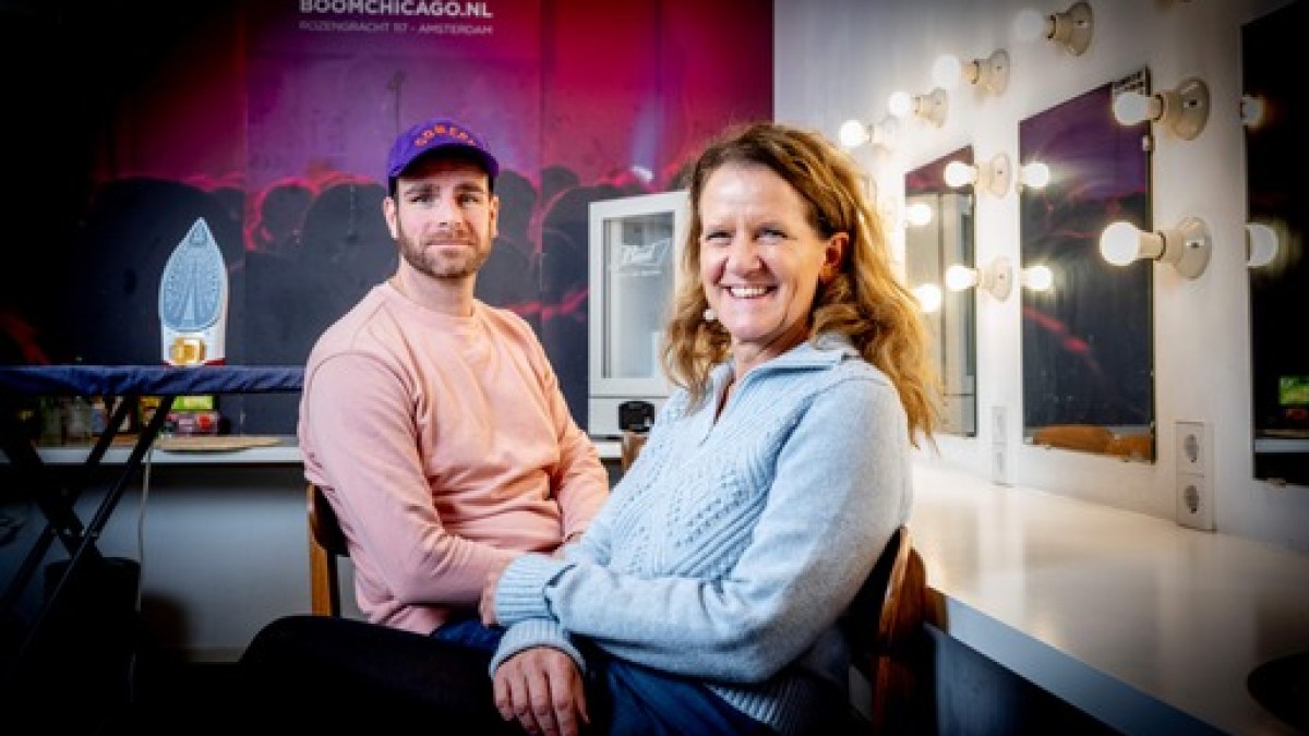 a man and a woman looking at the camera