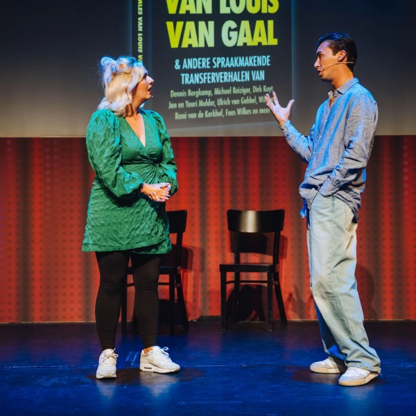 a man and a woman standing in a room