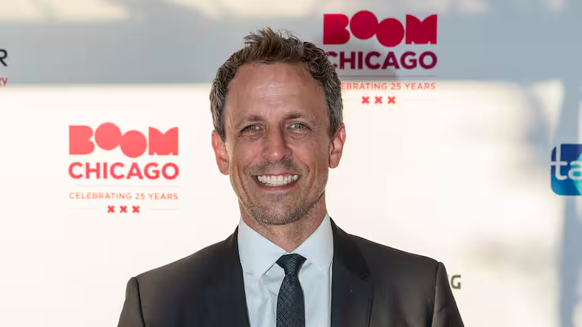 Screenshot 2024-05-21 at 15.36.37 Seth Meyers wearing a suit and tie smiling at the camera