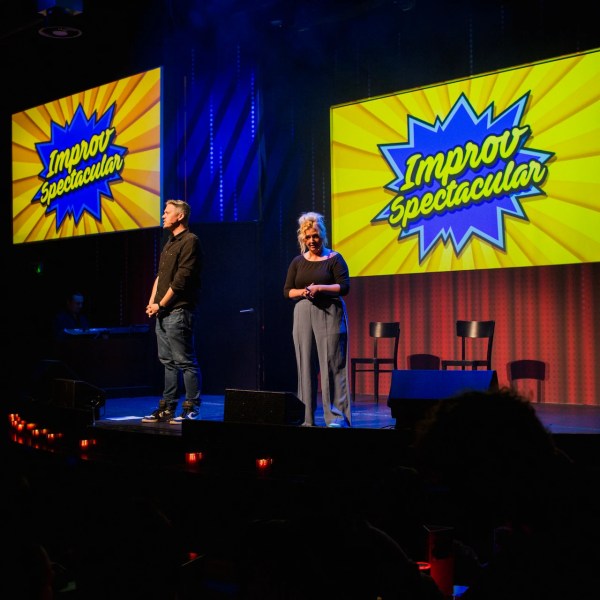 a group of people in a dark room