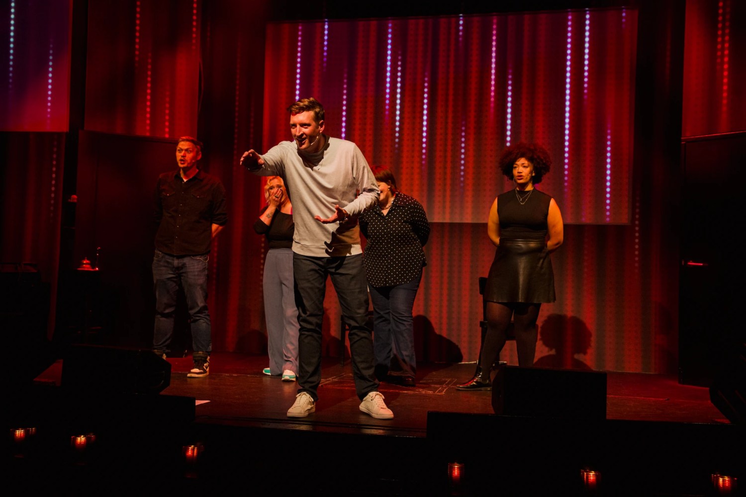 a group of people standing on a stage