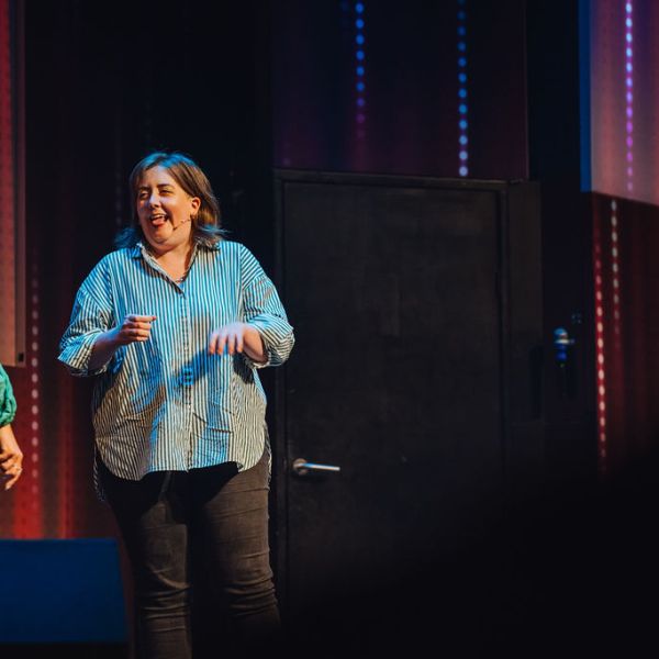 a person standing in front of a stage