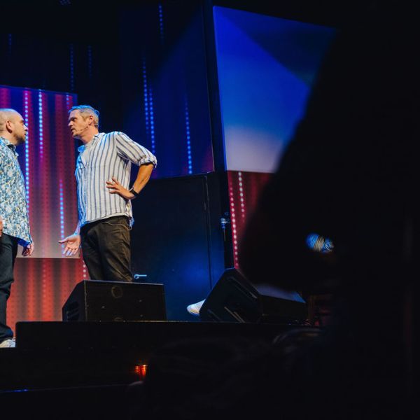 a man standing in front of a stage