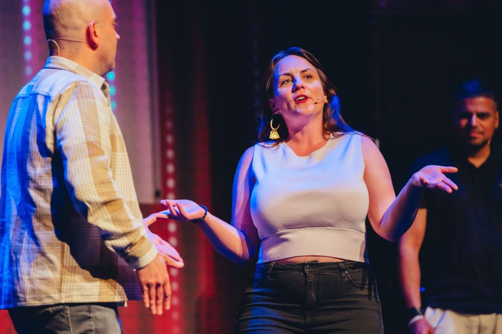 a couple of people standing on a stage