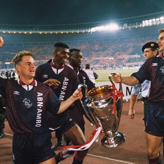 a group of people standing in front of a crowd