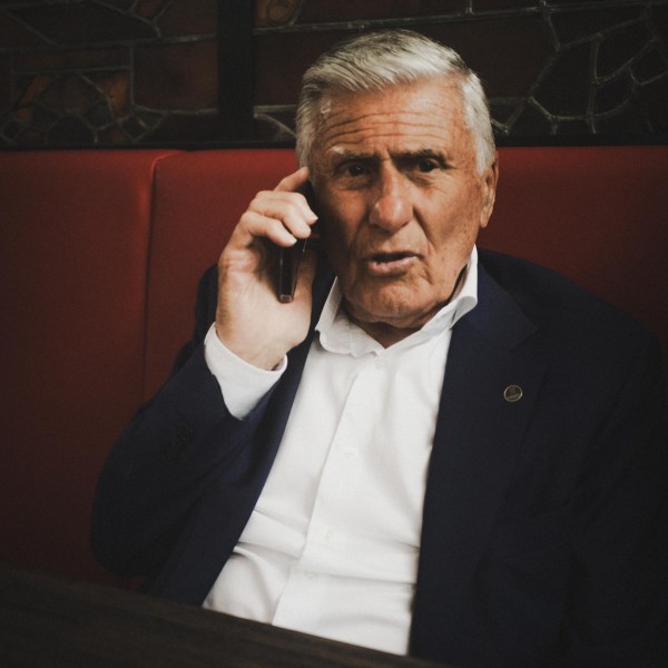 Sjaak Swart wearing a suit and tie