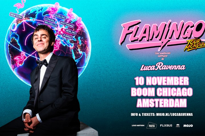 Man in a tuxedo sitting in front of a neon globe with tour locations and 'Flamingo Tour Mondiale' text.