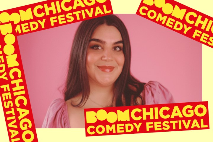 Woman in pink top with 'Boom Chicago Comedy Festival' banners on a pink background.