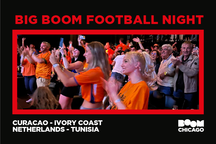 Cheering crowd at Big Boom Football Night in orange shirts.